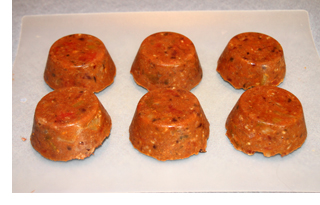 Frozen chili portions on a cutting board.